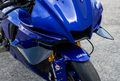 Yamaha R1 with gloss-black front fairing winglets, close-up front three-quarter view