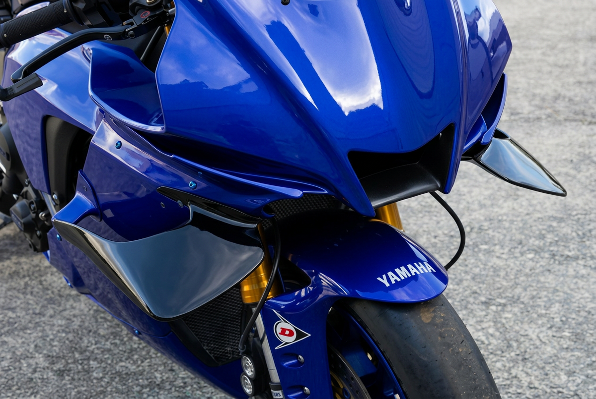 Yamaha R1 with gloss-black front fairing winglets, close-up front three-quarter view